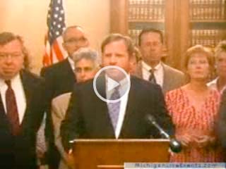 Paul Long speaking at press conference